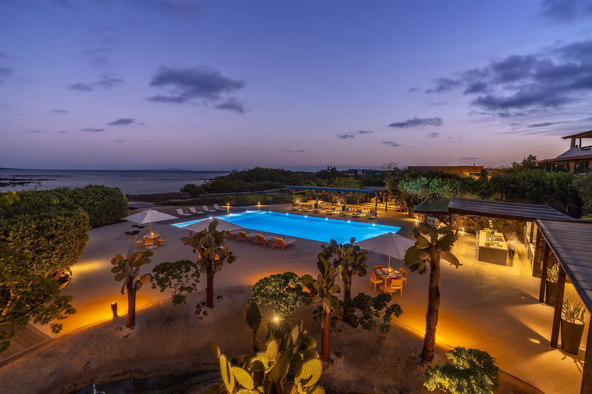 Poolside at dusk overlooking the ocean
